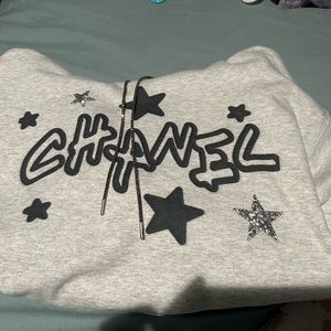 Chanel labeled hoodie with rhinestone stars and drawstring